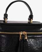 Beauty bag made of precious lambskin with a wrinkled effect and a delicate polished finish, with hand handle and adjustable and removable leather shoulder strap.

Upper zipper. The bag is equipped with a practical makeup mirror and a leather lipstick compartment.

Accessories with gold finish.

Material: Moon lamb
Dimensions: 19x14x10 cm