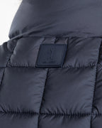 A clean, no-nonsense gilet built for layering. The box-quilt construction gives it structure and warmth, while the streamlined full-zip closure and high stand collar block the wind without adding bulk. Two side slip pockets sit flush with the quilting — functional without interrupting the clean lines.