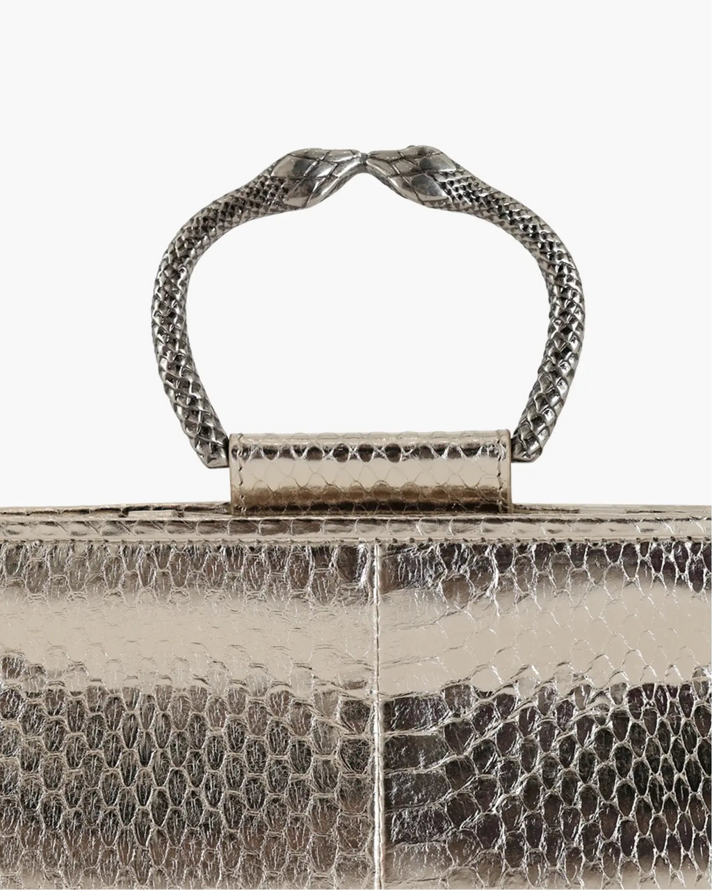 Clutch in precious silver-colored snake leather with round rigid body and removable leather strap.Brass bracelet, iconic accessory of the Tramontano archive handcrafted.Top closure with double magnets.

Microfiber lining. Accessories in gold finish.

Material: Snake Elaphe
Dimensions: 20x11x7 cm