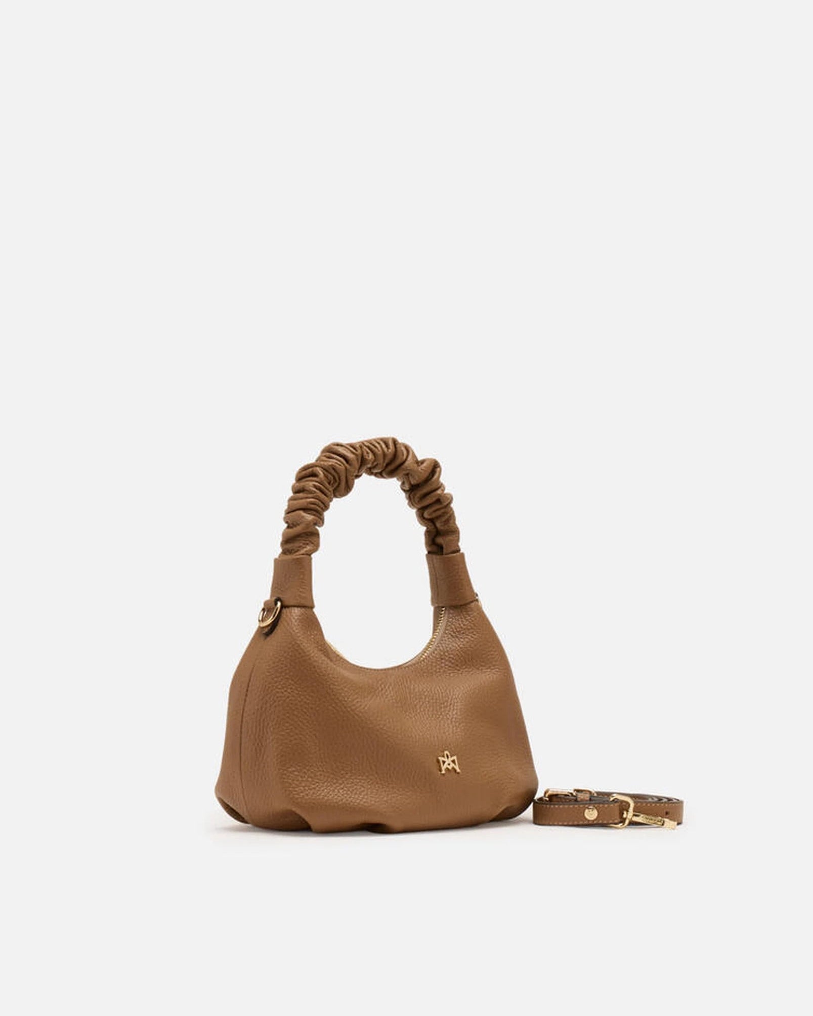 Description
Small but full of character, the mini hobo from the Chop line is the accessory that adds a touch of playful femininity to any outfit. Its soft design and ruched shoulder strap express a relaxed elegance, while the artisanal quality of the materials brings a sophisticated touch. Perfect for evenings out or casual weekends, it's a bag that surprises with its lightness and authentic style.

Composition
Suede is made from the lower part of the leather, which is softer and more flexible than the oute