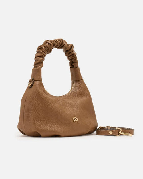 Description
Small but full of character, the mini hobo from the Chop line is the accessory that adds a touch of playful femininity to any outfit. Its soft design and ruched shoulder strap express a relaxed elegance, while the artisanal quality of the materials brings a sophisticated touch. Perfect for evenings out or casual weekends, it's a bag that surprises with its lightness and authentic style.

Composition
Suede is made from the lower part of the leather, which is softer and more flexible than the oute