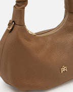 Description
Small but full of character, the mini hobo from the Chop line is the accessory that adds a touch of playful femininity to any outfit. Its soft design and ruched shoulder strap express a relaxed elegance, while the artisanal quality of the materials brings a sophisticated touch. Perfect for evenings out or casual weekends, it's a bag that surprises with its lightness and authentic style.

Composition
Suede is made from the lower part of the leather, which is softer and more flexible than the oute