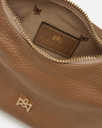 Description
Small but full of character, the mini hobo from the Chop line is the accessory that adds a touch of playful femininity to any outfit. Its soft design and ruched shoulder strap express a relaxed elegance, while the artisanal quality of the materials brings a sophisticated touch. Perfect for evenings out or casual weekends, it's a bag that surprises with its lightness and authentic style.

Composition
Suede is made from the lower part of the leather, which is softer and more flexible than the oute