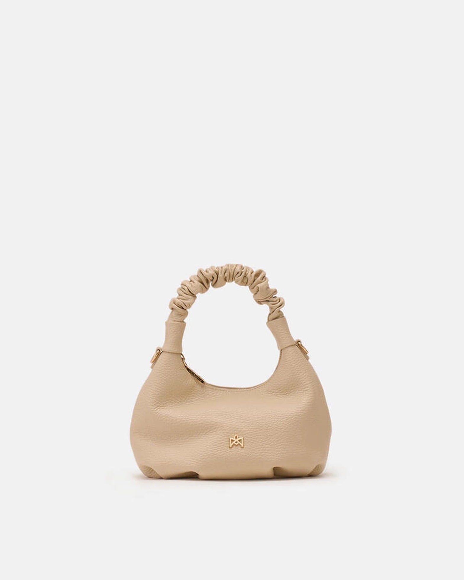 Description
Small but full of character, the mini hobo from the Chop line is the accessory that adds a touch of playful femininity to any outfit. Its soft design and ruched shoulder strap express a relaxed elegance, while the artisanal quality of the materials brings a sophisticated touch. Perfect for evenings out or casual weekends, it's a bag that surprises with its lightness and authentic style.

Composition
Suede is made from the lower part of the leather, which is softer and more flexible than the oute