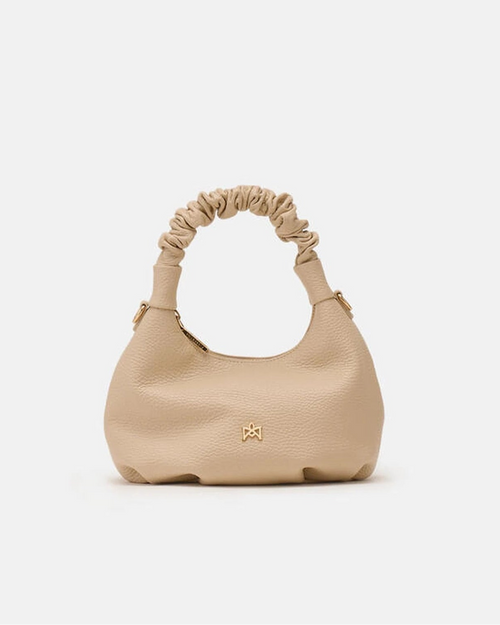 Description
Small but full of character, the mini hobo from the Chop line is the accessory that adds a touch of playful femininity to any outfit. Its soft design and ruched shoulder strap express a relaxed elegance, while the artisanal quality of the materials brings a sophisticated touch. Perfect for evenings out or casual weekends, it's a bag that surprises with its lightness and authentic style.

Composition
Suede is made from the lower part of the leather, which is softer and more flexible than the oute