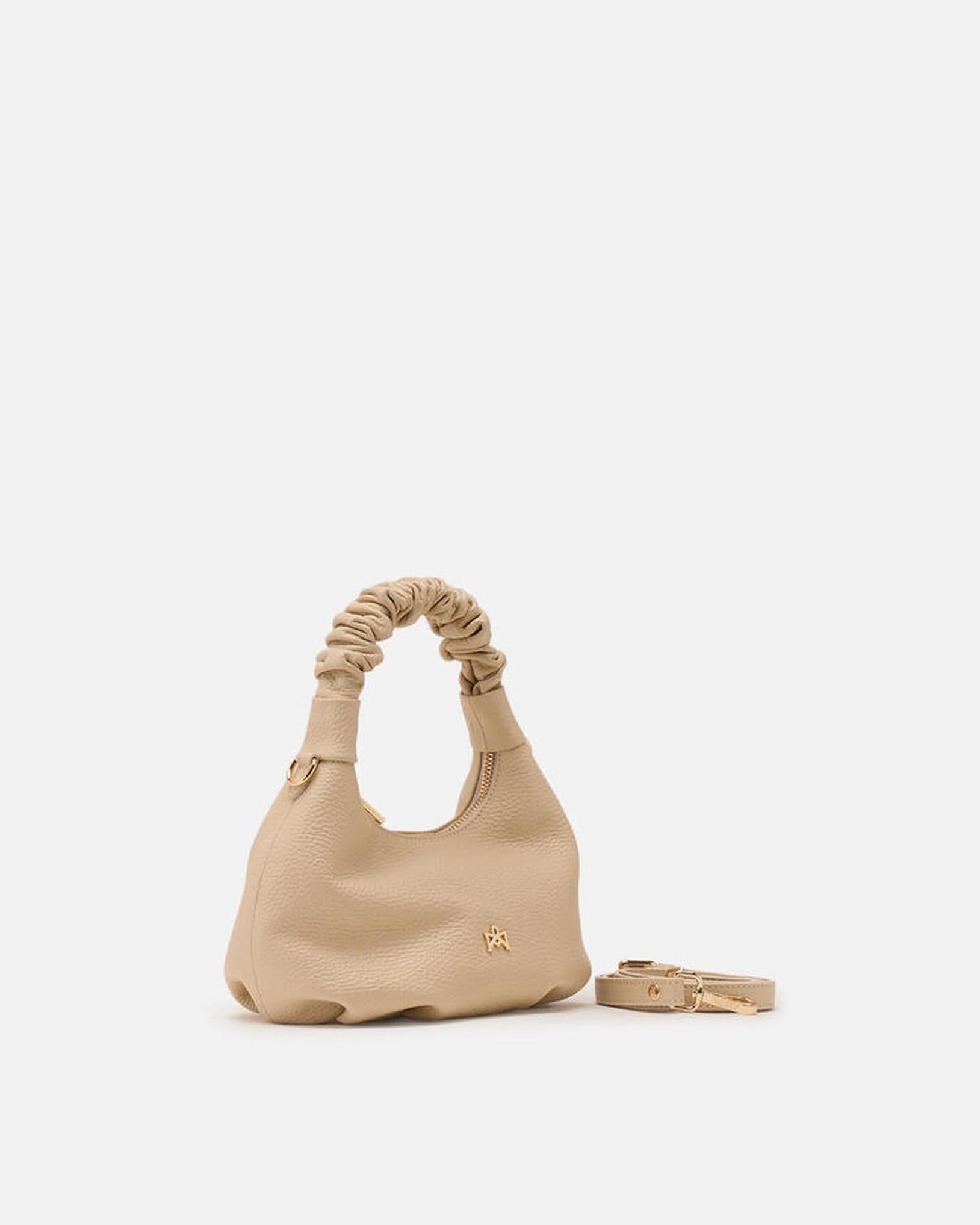 Description
Small but full of character, the mini hobo from the Chop line is the accessory that adds a touch of playful femininity to any outfit. Its soft design and ruched shoulder strap express a relaxed elegance, while the artisanal quality of the materials brings a sophisticated touch. Perfect for evenings out or casual weekends, it's a bag that surprises with its lightness and authentic style.

Composition
Suede is made from the lower part of the leather, which is softer and more flexible than the oute