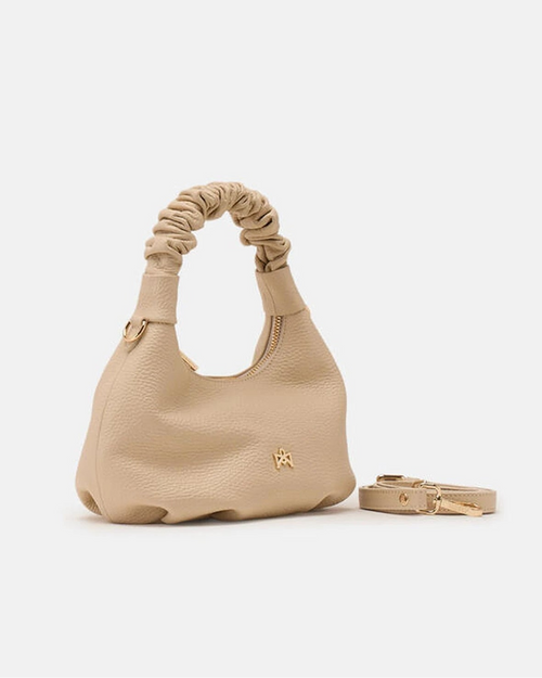 Description
Small but full of character, the mini hobo from the Chop line is the accessory that adds a touch of playful femininity to any outfit. Its soft design and ruched shoulder strap express a relaxed elegance, while the artisanal quality of the materials brings a sophisticated touch. Perfect for evenings out or casual weekends, it's a bag that surprises with its lightness and authentic style.

Composition
Suede is made from the lower part of the leather, which is softer and more flexible than the oute