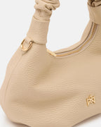 Description
Small but full of character, the mini hobo from the Chop line is the accessory that adds a touch of playful femininity to any outfit. Its soft design and ruched shoulder strap express a relaxed elegance, while the artisanal quality of the materials brings a sophisticated touch. Perfect for evenings out or casual weekends, it's a bag that surprises with its lightness and authentic style.

Composition
Suede is made from the lower part of the leather, which is softer and more flexible than the oute