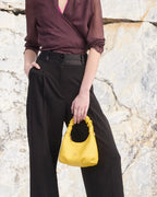 Description
Small but full of character, the mini hobo from the Chop line is the accessory that adds a touch of playful femininity to any outfit. Its soft design and ruched shoulder strap express a relaxed elegance, while the artisanal quality of the materials brings a sophisticated touch. Perfect for evenings out or casual weekends, it's a bag that surprises with its lightness and authentic style.

Composition
Suede is made from the lower part of the leather, which is softer and more flexible than the oute