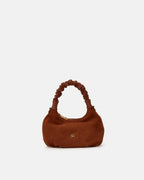 Description
Small but full of character, the mini hobo from the Chop line is the accessory that adds a touch of playful femininity to any outfit. Its soft design and ruched shoulder strap express a relaxed elegance, while the artisanal quality of the materials brings a sophisticated touch. Perfect for evenings out or casual weekends, it's a bag that surprises with its lightness and authentic style.

Composition
Suede is made from the lower part of the leather, which is softer and more flexible than the oute