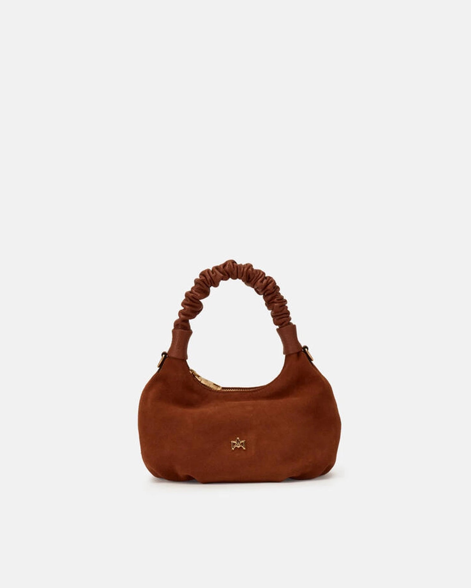 Description
Small but full of character, the mini hobo from the Chop line is the accessory that adds a touch of playful femininity to any outfit. Its soft design and ruched shoulder strap express a relaxed elegance, while the artisanal quality of the materials brings a sophisticated touch. Perfect for evenings out or casual weekends, it's a bag that surprises with its lightness and authentic style.

Composition
Suede is made from the lower part of the leather, which is softer and more flexible than the oute