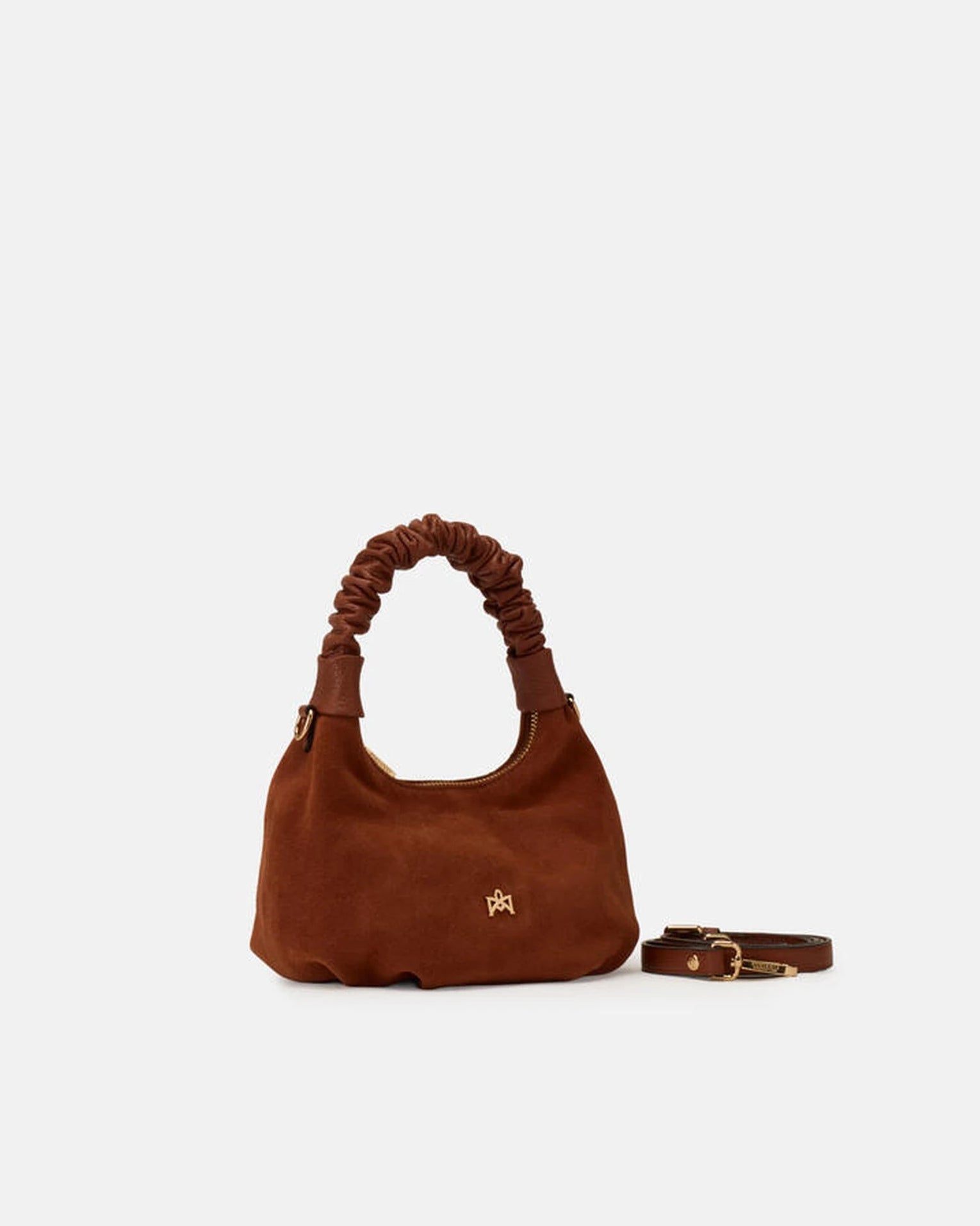 Description
Small but full of character, the mini hobo from the Chop line is the accessory that adds a touch of playful femininity to any outfit. Its soft design and ruched shoulder strap express a relaxed elegance, while the artisanal quality of the materials brings a sophisticated touch. Perfect for evenings out or casual weekends, it's a bag that surprises with its lightness and authentic style.

Composition
Suede is made from the lower part of the leather, which is softer and more flexible than the oute