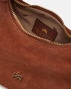 Description
Small but full of character, the mini hobo from the Chop line is the accessory that adds a touch of playful femininity to any outfit. Its soft design and ruched shoulder strap express a relaxed elegance, while the artisanal quality of the materials brings a sophisticated touch. Perfect for evenings out or casual weekends, it's a bag that surprises with its lightness and authentic style.

Composition
Suede is made from the lower part of the leather, which is softer and more flexible than the oute