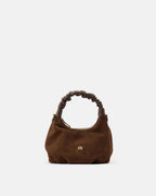 Description
Small but full of character, the mini hobo from the Chop line is the accessory that adds a touch of playful femininity to any outfit. Its soft design and ruched shoulder strap express a relaxed elegance, while the artisanal quality of the materials brings a sophisticated touch. Perfect for evenings out or casual weekends, it's a bag that surprises with its lightness and authentic style.

Composition
Suede is made from the lower part of the leather, which is softer and more flexible than the oute