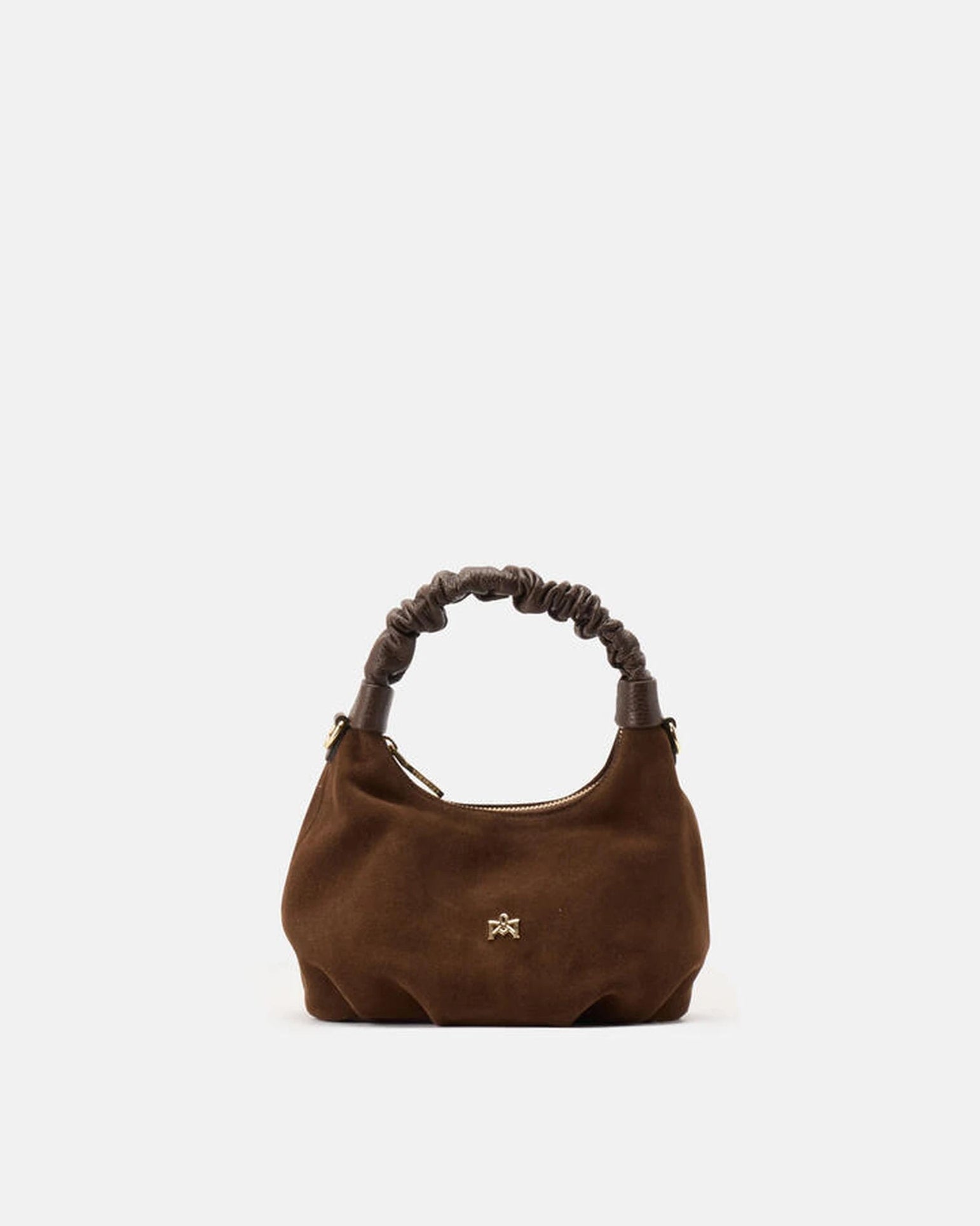 Description
Small but full of character, the mini hobo from the Chop line is the accessory that adds a touch of playful femininity to any outfit. Its soft design and ruched shoulder strap express a relaxed elegance, while the artisanal quality of the materials brings a sophisticated touch. Perfect for evenings out or casual weekends, it's a bag that surprises with its lightness and authentic style.

Composition
Suede is made from the lower part of the leather, which is softer and more flexible than the oute