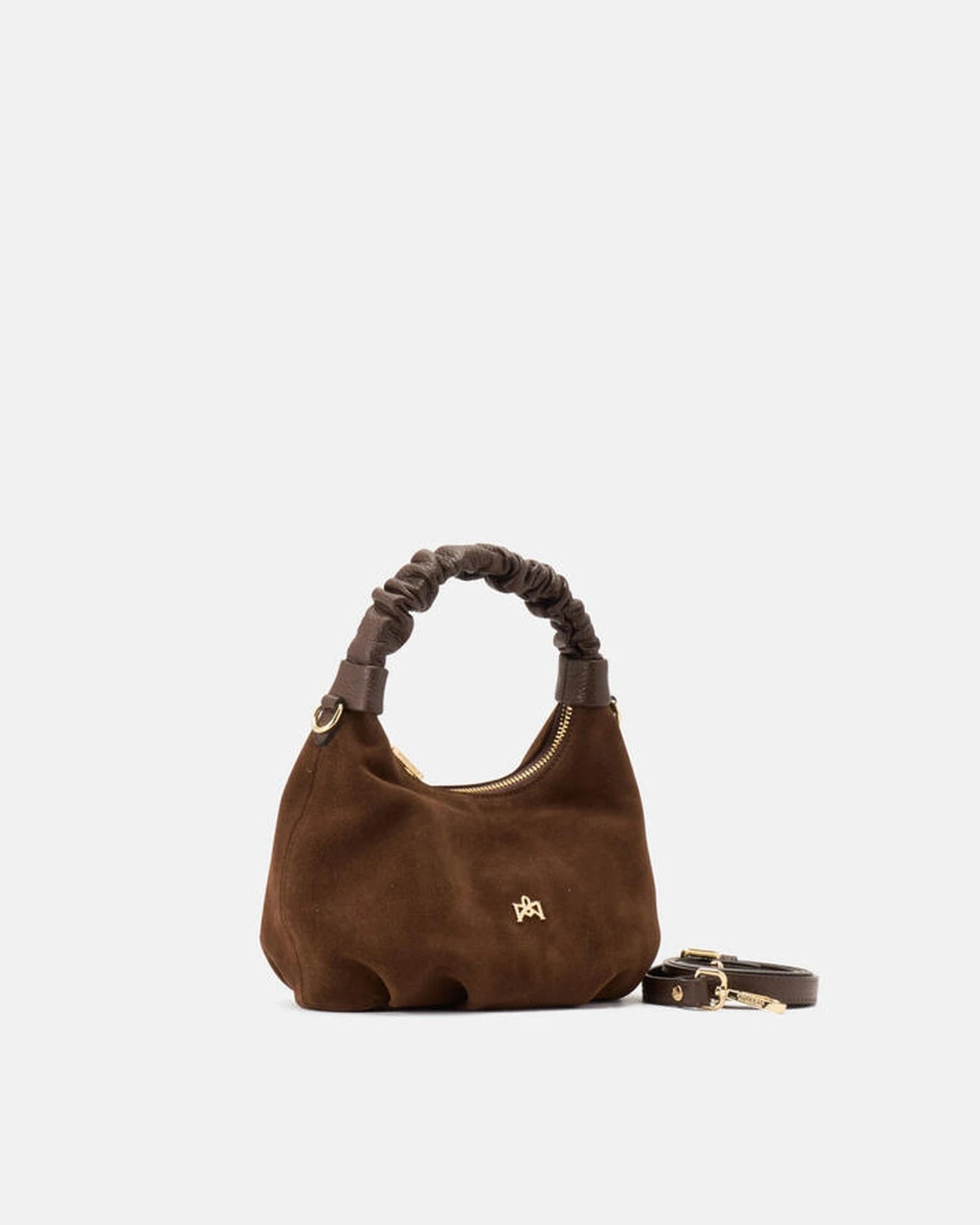 Description
Small but full of character, the mini hobo from the Chop line is the accessory that adds a touch of playful femininity to any outfit. Its soft design and ruched shoulder strap express a relaxed elegance, while the artisanal quality of the materials brings a sophisticated touch. Perfect for evenings out or casual weekends, it's a bag that surprises with its lightness and authentic style.

Composition
Suede is made from the lower part of the leather, which is softer and more flexible than the oute