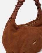 Description
The medium Chop hobo is designed for those who appreciate everyday elegance made of softness and refined details. The ruched shoulder strap and enveloping silhouette gracefully interpret the boho spirit of the season, while the high-quality materials give it an authentic and accessible charm. A perfect style companion for any moment.

Composition
This soft full-grain calfskin, is worked to obtain an uniform grain, called tumbled leather. The remarkable fullness and roundness of the hand make it 