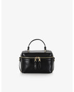 Beauty bag made of precious lambskin with a wrinkled effect and a delicate polished finish, with hand handle and adjustable and removable leather shoulder strap.

Upper zipper. The bag is equipped with a practical makeup mirror and a leather lipstick compartment.

Accessories with gold finish.

Material: Moon lamb
Dimensions: 19x14x10 cm