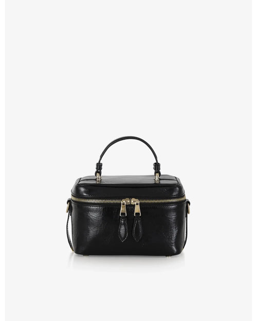 Beauty bag made of precious lambskin with a wrinkled effect and a delicate polished finish, with hand handle and adjustable and removable leather shoulder strap.

Upper zipper. The bag is equipped with a practical makeup mirror and a leather lipstick compartment.

Accessories with gold finish.

Material: Moon lamb
Dimensions: 19x14x10 cm