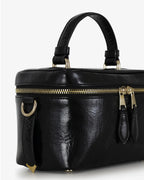 Beauty bag made of precious lambskin with a wrinkled effect and a delicate polished finish, with hand handle and adjustable and removable leather shoulder strap.

Upper zipper. The bag is equipped with a practical makeup mirror and a leather lipstick compartment.

Accessories with gold finish.

Material: Moon lamb
Dimensions: 19x14x10 cm