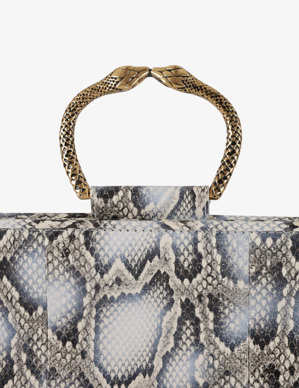 Clutch in precious snake leather with rounding rigid body and removable leather crossbody.Brass bracelet, iconic accessory of the Tramontano archive handcrafted.Top closure with double magnets. Microfiber lining. Accessories in gold finish. Material: Snake ElapheDimensions: 31x12x8 cm