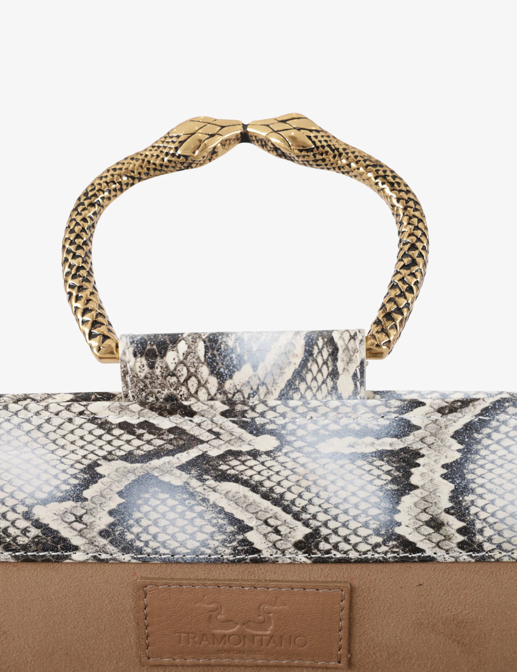 Clutch in precious snake leather with rounding rigid body and removable leather crossbody.Brass bracelet, iconic accessory of the Tramontano archive handcrafted.Top closure with double magnets. Microfiber lining. Accessories in gold finish. Material: Snake ElapheDimensions: 31x12x8 cm