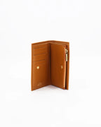 A small, lightweight wallet that can hold all the essentials. To have everything you need with you even on the most important evenings, without sacrificing style.

Internal details: double compartment with button closure, 6 credit card slots, 4 pockets, double bill compartment and zipped purse.
External details: gold embossed logo.
Lining: customised and internal slot in silk.

This soft full-grain calfskin, is worked to obtain an uniform grain, called tumbled leather. The remarkable fullness and roundness 