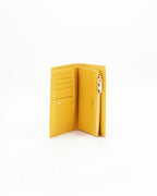 A small, lightweight wallet that can hold all the essentials. To have everything you need with you even on the most important evenings, without sacrificing style.

Internal details: double compartment with button closure, 6 credit card slots, 4 pockets, double bill compartment and zipped purse.
External details: gold embossed logo.
Lining: customised and internal slot in silk.

This soft full-grain calfskin, is worked to obtain an uniform grain, called tumbled leather. The remarkable fullness and roundness 