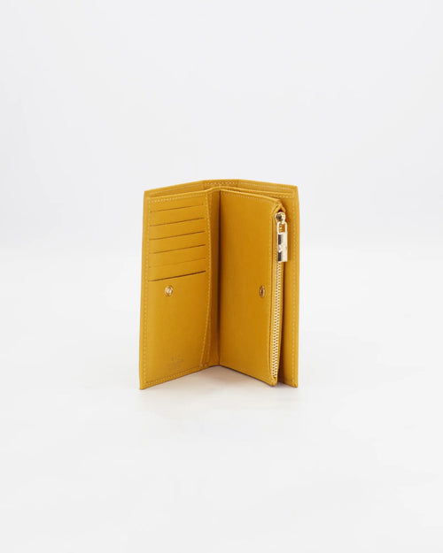 A small, lightweight wallet that can hold all the essentials. To have everything you need with you even on the most important evenings, without sacrificing style.

Internal details: double compartment with button closure, 6 credit card slots, 4 pockets, double bill compartment and zipped purse.
External details: gold embossed logo.
Lining: customised and internal slot in silk.

This soft full-grain calfskin, is worked to obtain an uniform grain, called tumbled leather. The remarkable fullness and roundness 