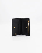 A small, lightweight wallet that can hold all the essentials. To have everything you need with you even on the most important evenings, without sacrificing style.

Internal details: double compartment with button closure, 6 credit card slots, 4 pockets, double bill compartment and zipped purse.
External details: gold embossed logo.
Lining: customised and internal slot in silk.

This soft full-grain calfskin, is worked to obtain an uniform grain, called tumbled leather. The remarkable fullness and roundness 