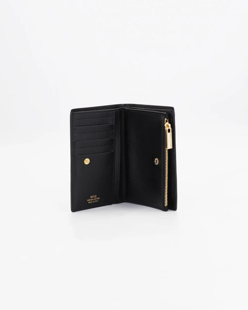 A small, lightweight wallet that can hold all the essentials. To have everything you need with you even on the most important evenings, without sacrificing style.

Internal details: double compartment with button closure, 6 credit card slots, 4 pockets, double bill compartment and zipped purse.
External details: gold embossed logo.
Lining: customised and internal slot in silk.

This soft full-grain calfskin, is worked to obtain an uniform grain, called tumbled leather. The remarkable fullness and roundness 