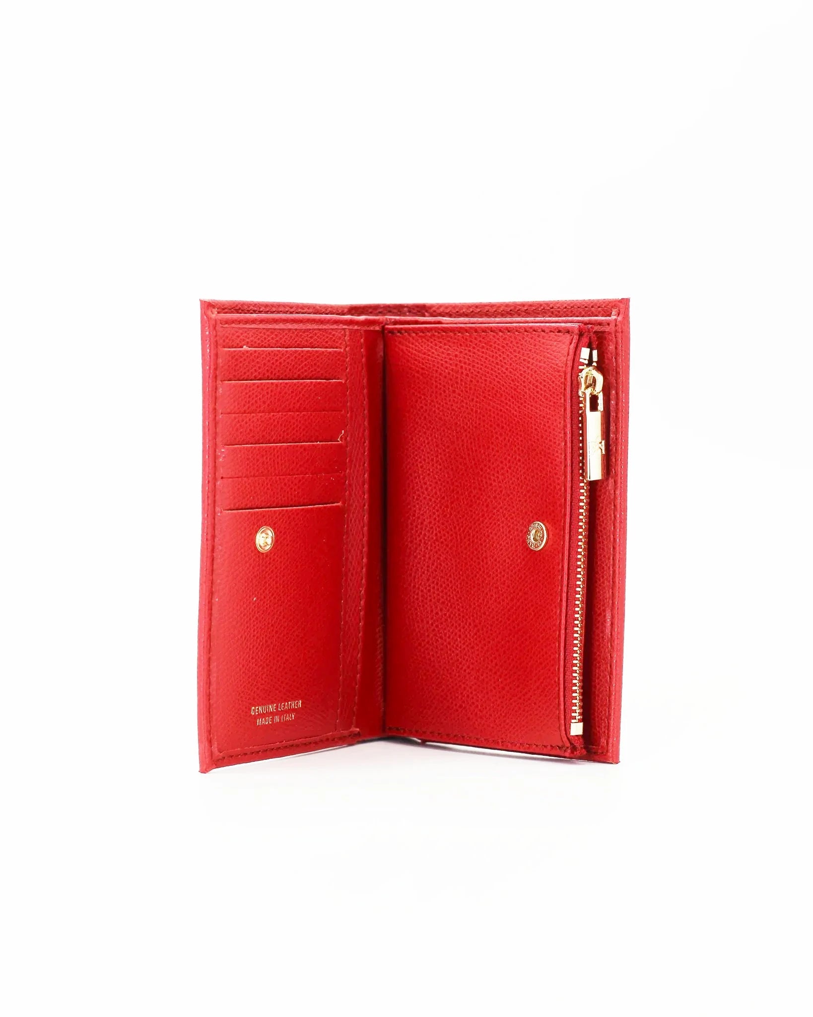 A small, lightweight wallet that can hold all the essentials. To have everything you need with you even on the most important evenings, without sacrificing style.

Internal details: double compartment with button closure, 6 credit card slots, 4 pockets, double bill compartment and zipped purse.
External details: gold embossed logo.
Lining: customised and internal slot in silk.

This soft full-grain calfskin, is worked to obtain an uniform grain, called tumbled leather. The remarkable fullness and roundness 