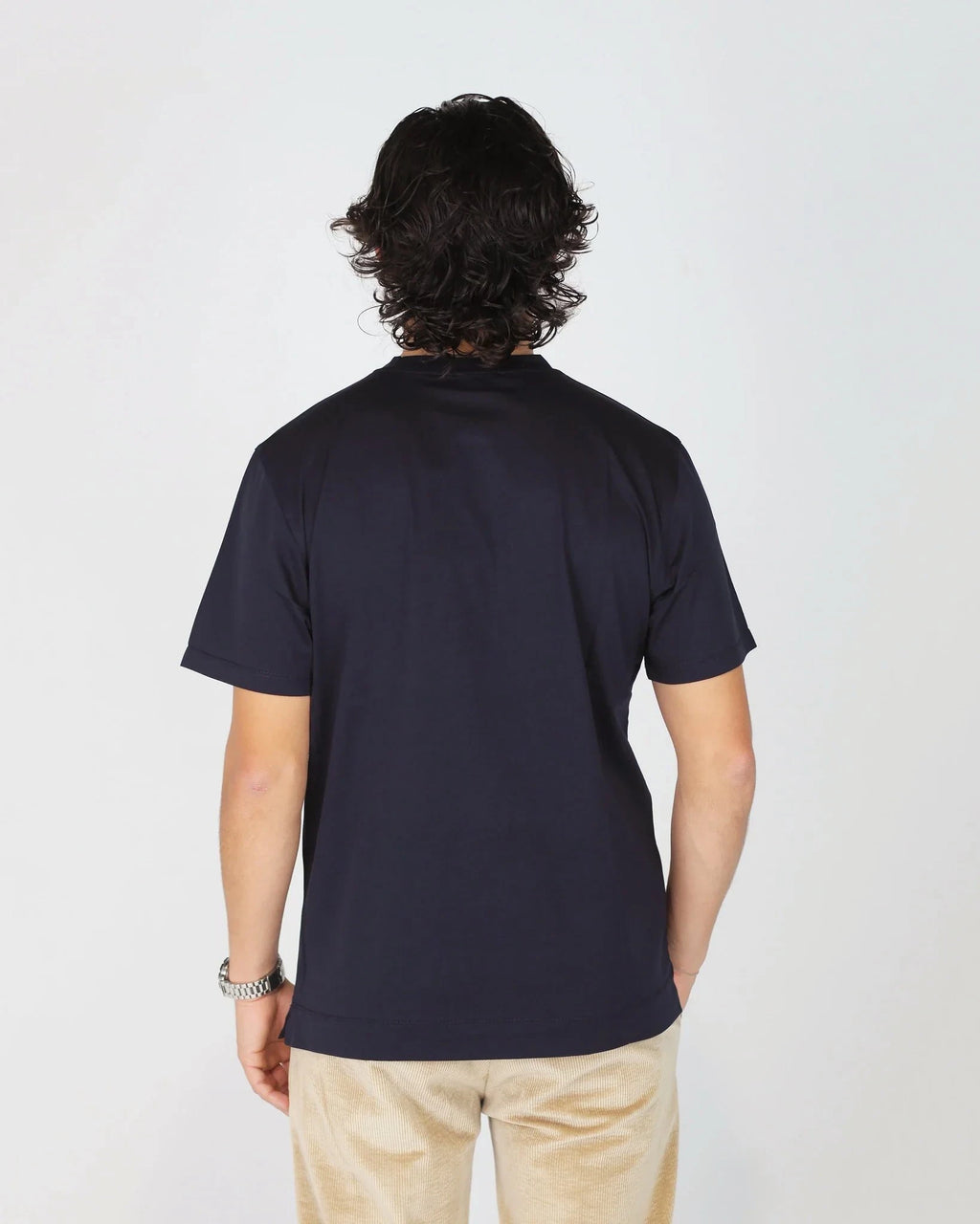 Elevate your everyday basics with the Fiftieth Men's Navy Blue Crew Neck T-Shirt. Made from 100% merchandised cotton with a regular fit — simple, clean, and built to last. 