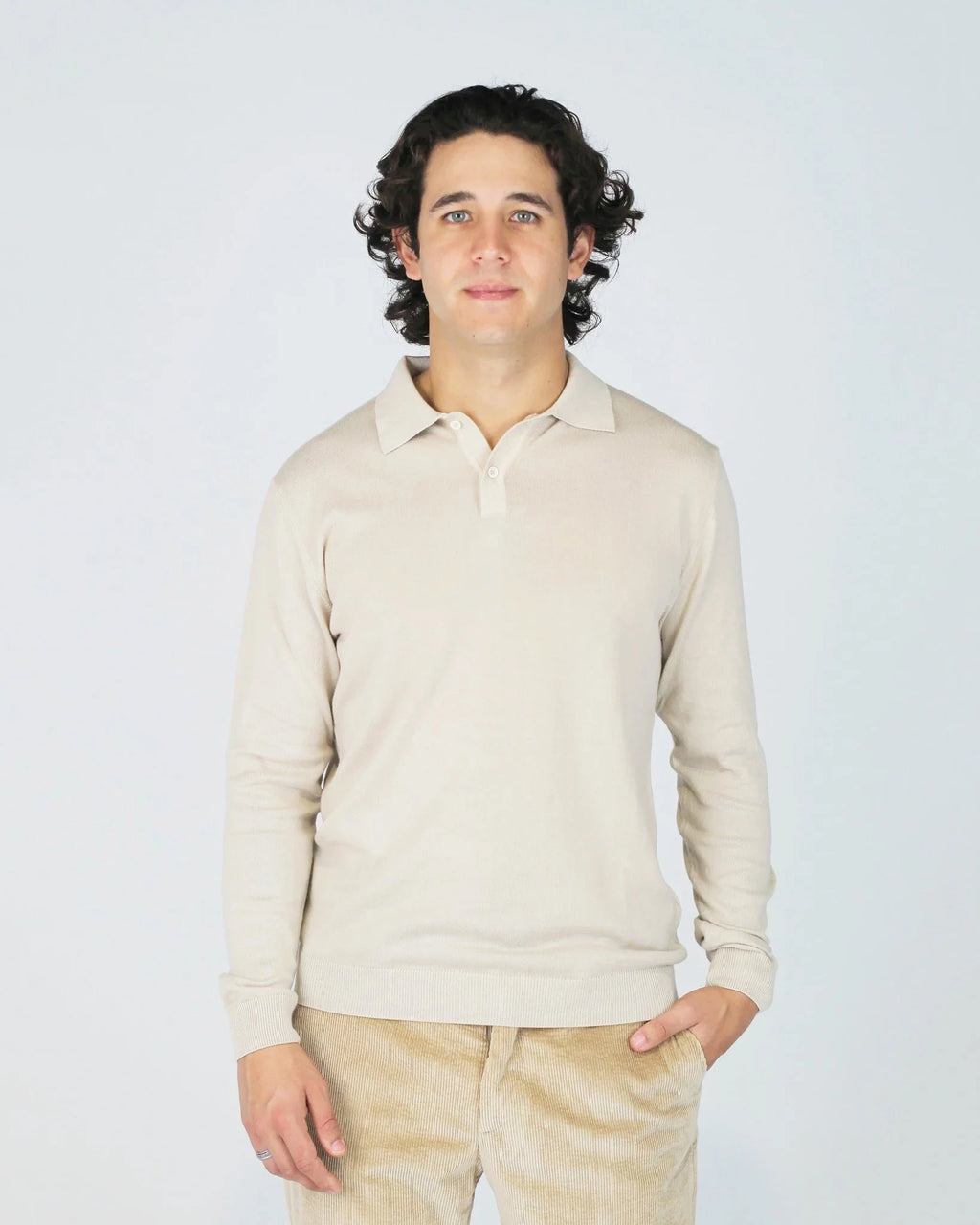 The Fiftieth Men's Cotton Long Sleeve Polo in Beige is a refined everyday essential crafted from 100% cotton. Featuring a classic polo collar and a relaxed regular fit, this versatile piece layers effortlessly or stands alone for a clean, polished look.