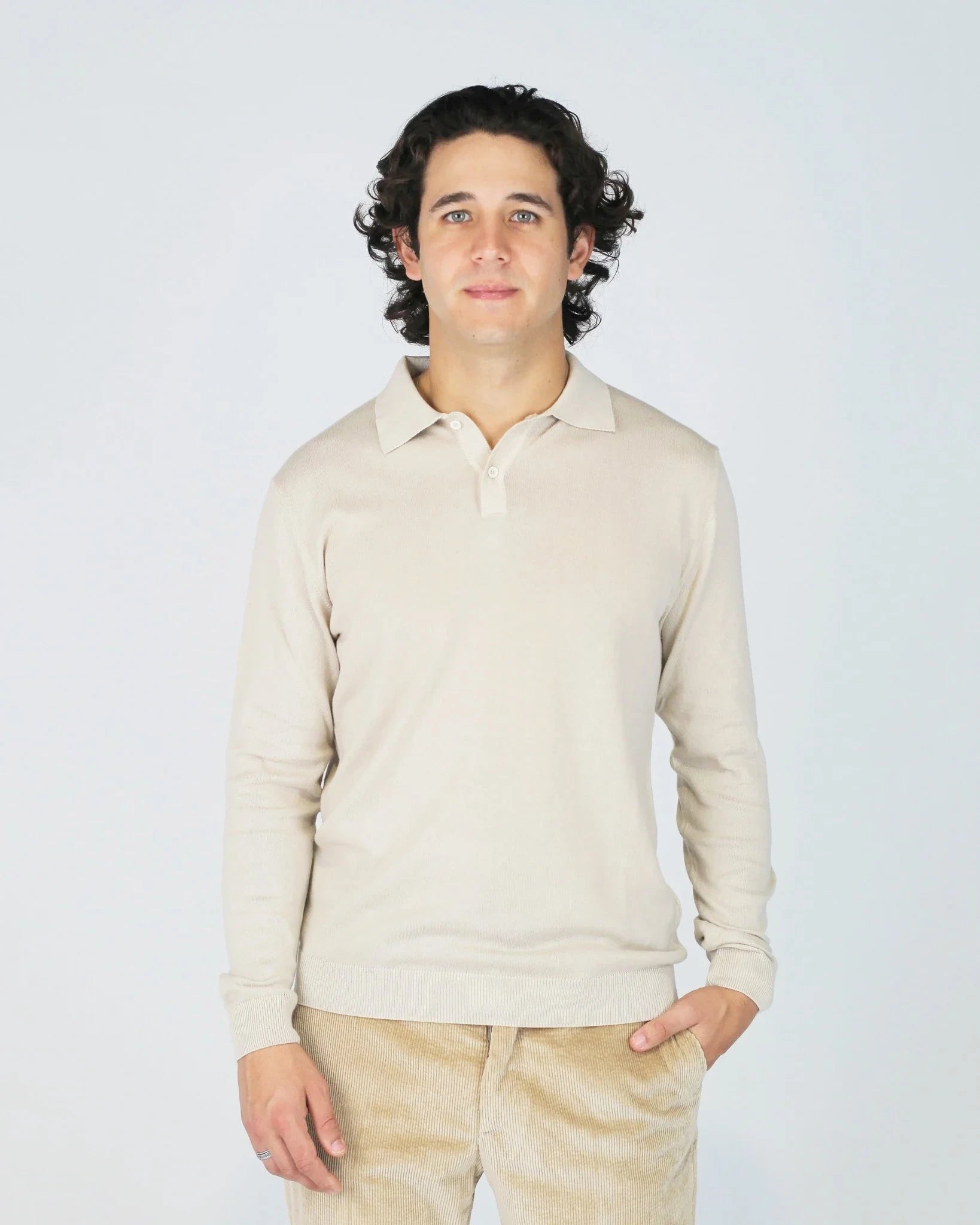 The Fiftieth Men's Cotton Long Sleeve Polo in Beige is a refined everyday essential crafted from 100% cotton. Featuring a classic polo collar and a relaxed regular fit, this versatile piece layers effortlessly or stands alone for a clean, polished look.