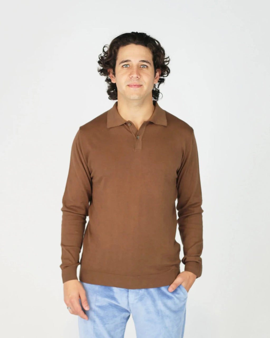 The Fiftieth Men's Cotton Long Sleeve Polo in Tabacco is a refined everyday essential crafted from 100% cotton. Featuring a classic polo collar and a relaxed regular fit, this versatile piece layers effortlessly or stands alone for a clean, polished look.