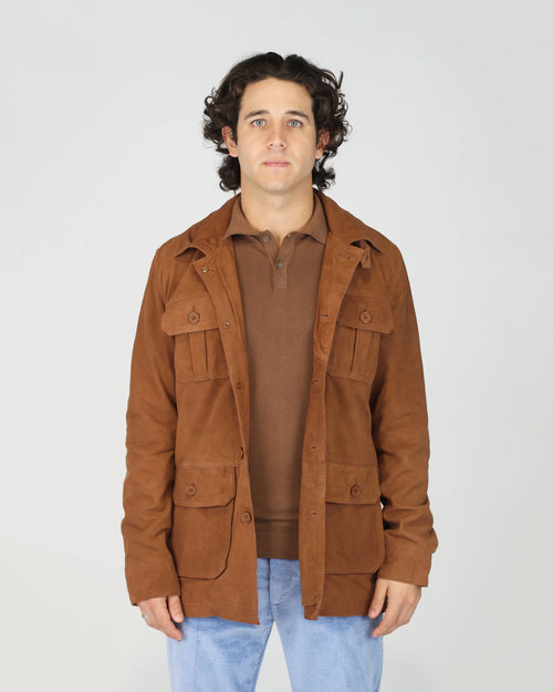 The Fusaro Antonio Men's Utility Jacket in Tabacco is a rugged yet refined layering piece that brings effortless character to any outfit. Cut in a rich tobacco-brown suede-effect fabric, this utility jacket features a classic shirt collar, button-through front and four front patch pockets for a functional, workwear-inspired aesthetic. The relaxed regular fit makes it an ideal transitional piece — dressed up over a knit or kept casual with denim.