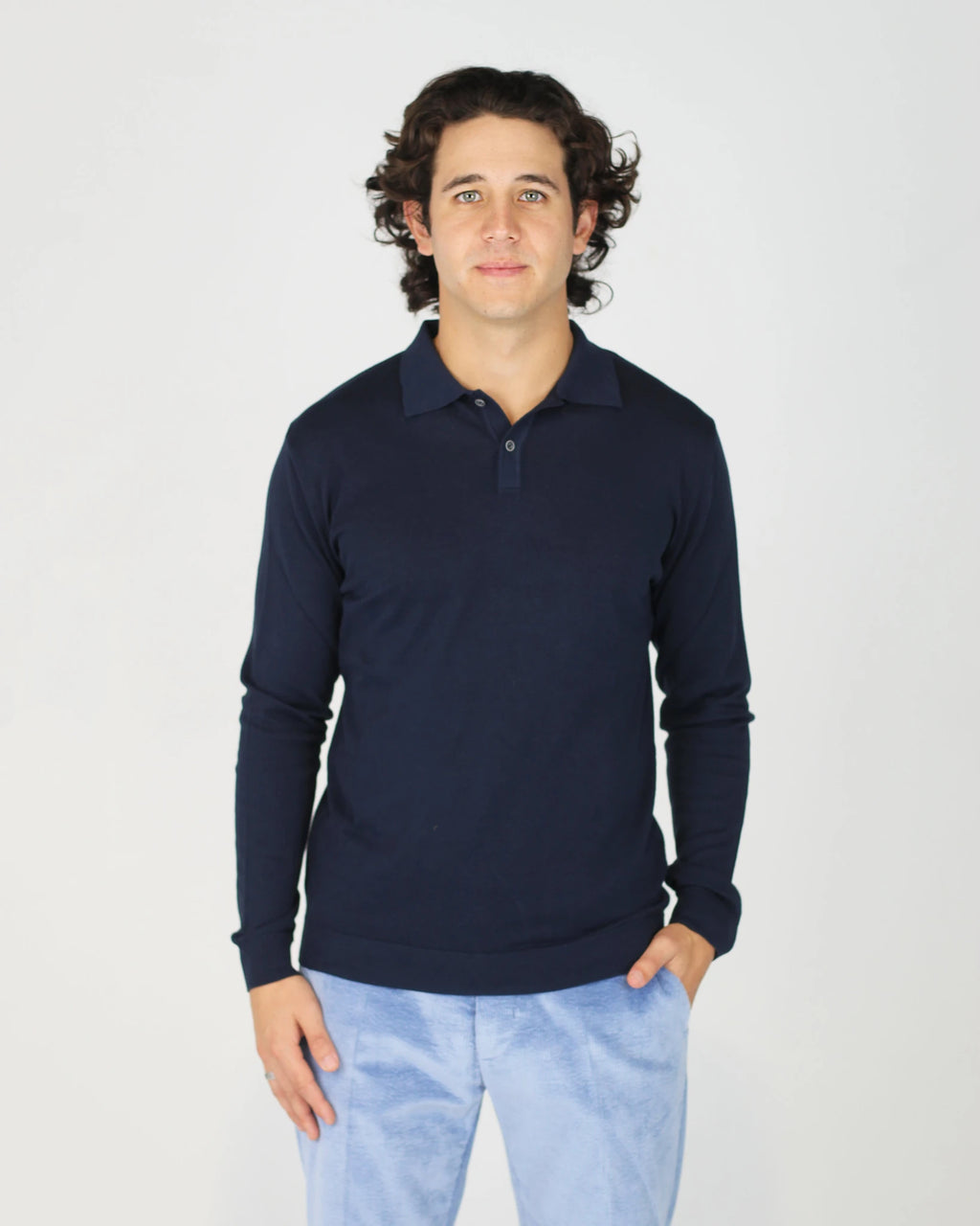 The Fiftieth Men's Cotton Long Sleeve Polo in Navy Blue is a refined everyday essential crafted from 100% cotton. Featuring a classic polo collar and a relaxed regular fit, this versatile piece layers effortlessly or stands alone for a clean, polished look.