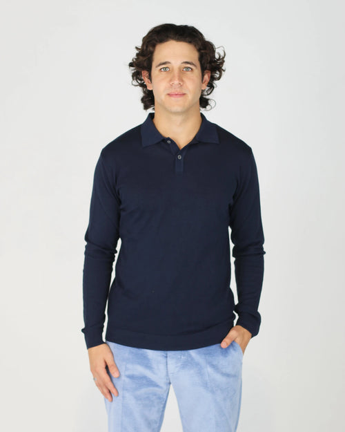 The Fiftieth Men's Cotton Long Sleeve Polo in Navy Blue is a refined everyday essential crafted from 100% cotton. Featuring a classic polo collar and a relaxed regular fit, this versatile piece layers effortlessly or stands alone for a clean, polished look.