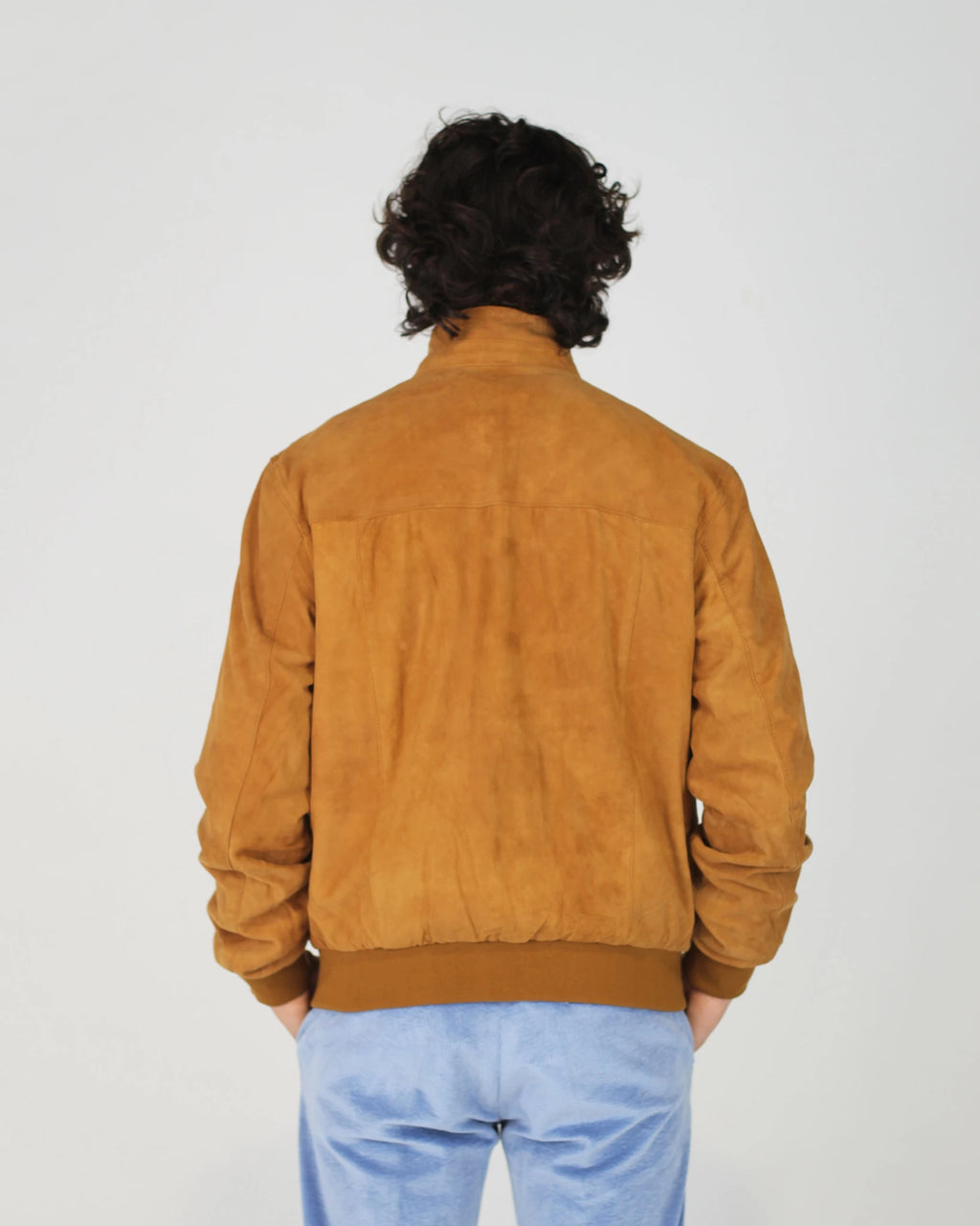 The Fusaro Antonio Bomber Jacket in Cognac is a wardrobe essential that bridges smart and casual effortlessly. Crafted in a luxurious suede-effect fabric, the rich cognac tone adds warmth and depth to any outfit. Featuring a classic zip-through silhouette with ribbed cuffs, collar and hem, this jacket offers a clean, tailored finish with everyday wearability.