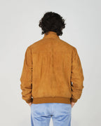 The Fusaro Antonio Bomber Jacket in Cognac is a wardrobe essential that bridges smart and casual effortlessly. Crafted in a luxurious suede-effect fabric, the rich cognac tone adds warmth and depth to any outfit. Featuring a classic zip-through silhouette with ribbed cuffs, collar and hem, this jacket offers a clean, tailored finish with everyday wearability.