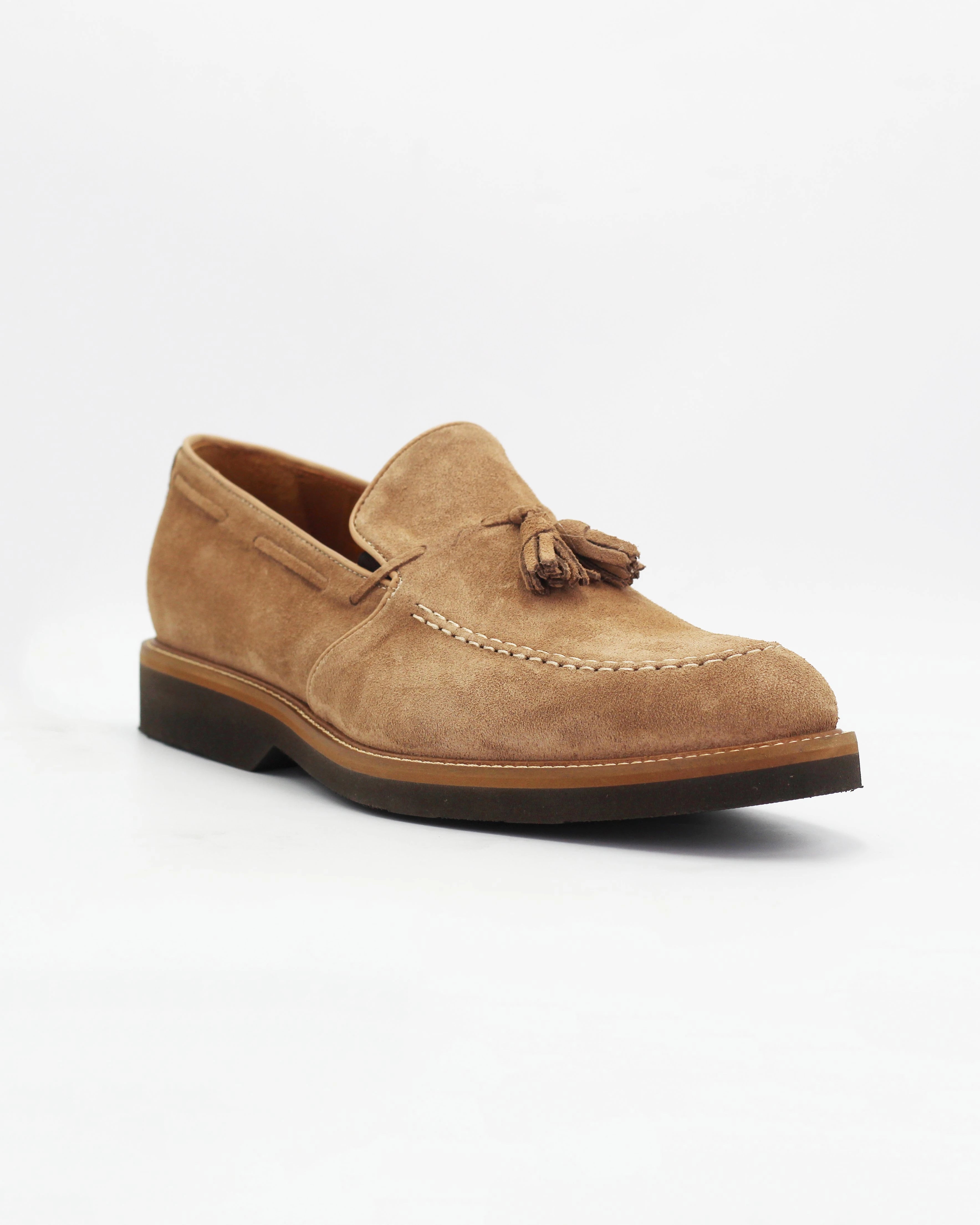 Men's Tassle Moccasin in Leather Suede Sabbia Beige is a refined slip-on with a distinctly classic character. Sand Beige Suede and a signature tassel detail give this loafer an effortlessly polished look, while the tan rubber sole adds a casual contrast finish.

Dress it up with tailored trousers or keep it casual with dark chinos — it works either way.

Features:

Style: Moccasin
Feature: Tassle
Colour: Sabbia
Material: Calf Leather Suede
Sole Material: Rubber


Code: MER7013

Made In Italy.