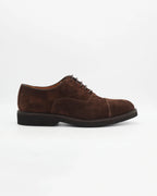 The Men's Oxford in Leather Suede Testa Di Moro&nbsp;is a refined take on a casual classic. The deep, rich suede upper gives it a luxurious texture and a subtle sophistication, while the clean derby silhouette keeps things understated and versatile.

Works equally well dressed up or down.

Style: Oxford
Colour: Testa Di Moro
Material: Calf Leather Suede
Sole Material: Rubber

Code: MER6649

Made in Italy