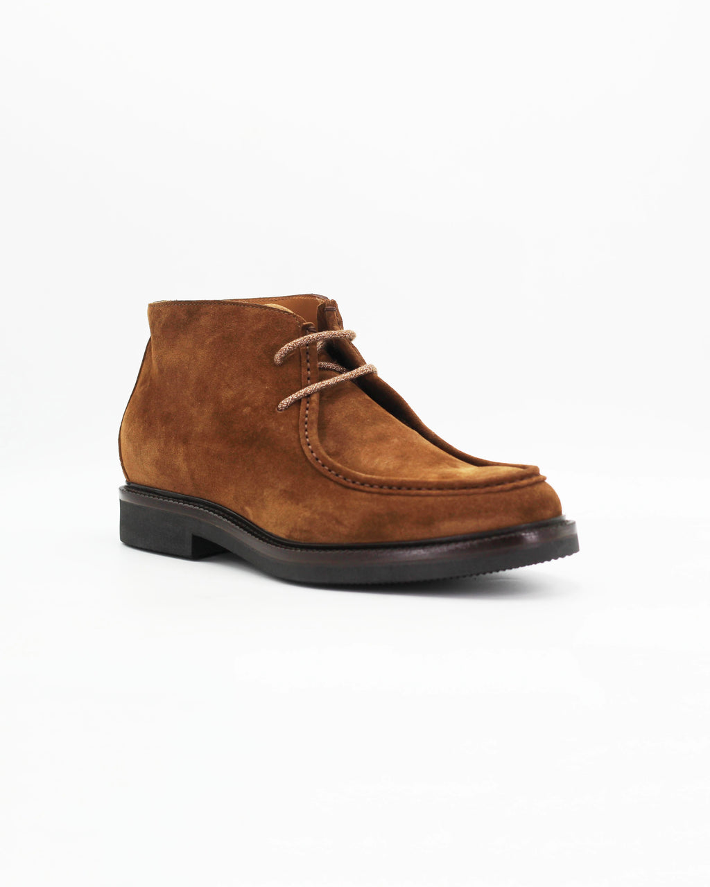 The Men's Chukka Boot in Suede Tan is a relaxed yet refined ankle boot crafted from soft tan suede. The clean, minimal silhouette and lace-up front make it a versatile go-to — equally at home with chinos, cords, or casual denim.

The suede upper gives it a relaxed, lived-in feel that only gets better with wear.&nbsp;
Style: Chukka Boot
Feature: Stitch Details
Colour: Marrone Tan
Material: Calf Leather Suede
Sole Material: Rubber

Code: MERS8890

Made in Italy
