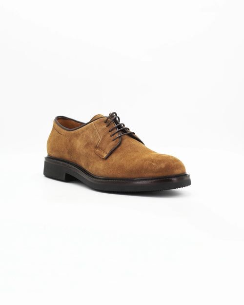 The Men's Derby in Leather Suede Castoro Beige&nbsp;is a relaxed take on the classic dress shoe. The soft tan suede upper gives it a warm, textured feel, while the clean derby silhouette keeps it smart enough for the office and casual enough for the weekend.

A wardrobe staple that pairs effortlessly with chinos, cords, or dark denim.
&nbsp;
Style: Derby
Feature: Light Sole
Colour: Castoro Beige
Material: Calf Leather Suede
Sole Material: Rubber

Code: MER8097

Made in Italy
