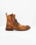 The Men's Brogue Ankle Boot in Leather Tan&nbsp;is a rugged yet refined lace-up boot crafted from rich cognac leather with a beautifully worn-in finish. Pairs perfectly with cuffed chinos, cords, or denim.

&nbsp;
Style: Ankle Boot
Feature: Brogue
Colour: Tan
Material: Calf Leather
Sole Material: Rubber

Code: JPU36526/260

Made in Italy