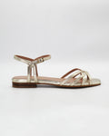 Shop the PATTY14 flat woven sandal in gold calf leather. Italian-made with a woven strap detail, adjustable ankle strap, and rubber sole. Effortless metallic elegance.
