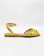 Shop the CIRA5 flat lattice sandal in lime suede calf leather. Italian-made with a woven strap detail, adjustable ankle strap, and rubber sole. Vibrant summer elegance.