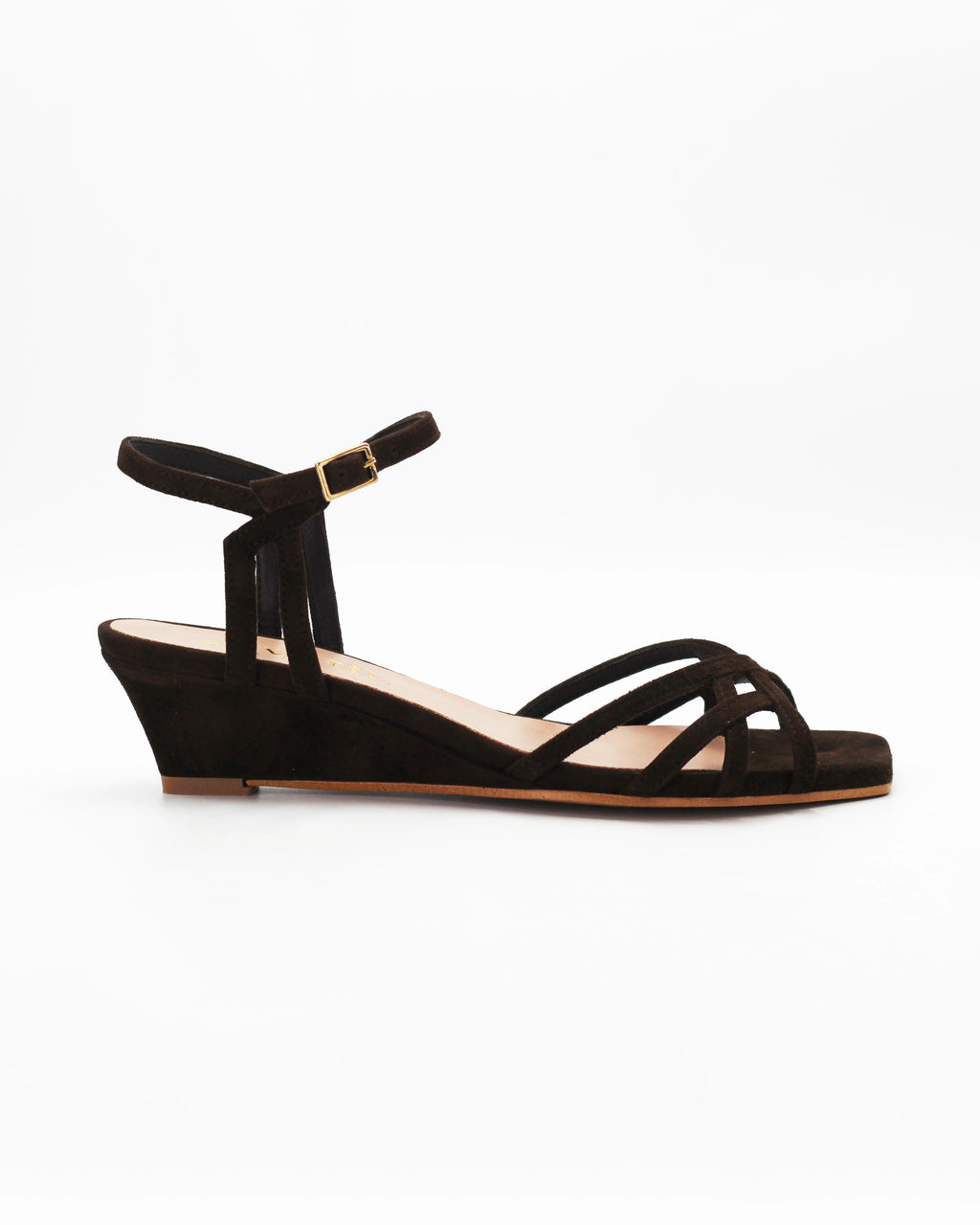 Shop the LYA8 wedge heel sandal in dark brown suede calf leather. Italian-made with a woven strap detail, adjustable ankle strap, and rubber sole. Elevated summer elegance.