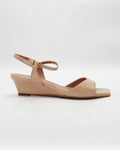Chic beige wedge sandals in smooth calf leather with an adjustable ankle strap. Handcrafted in Italy with a durable rubber sole. Effortless warm-weather style.